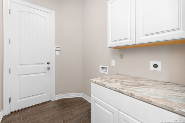 laundry room featuring cabinet space, baseboards, dark wood finished floors, washer hookup, and electric dryer hookup