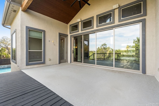 wooden terrace featuring a patio area