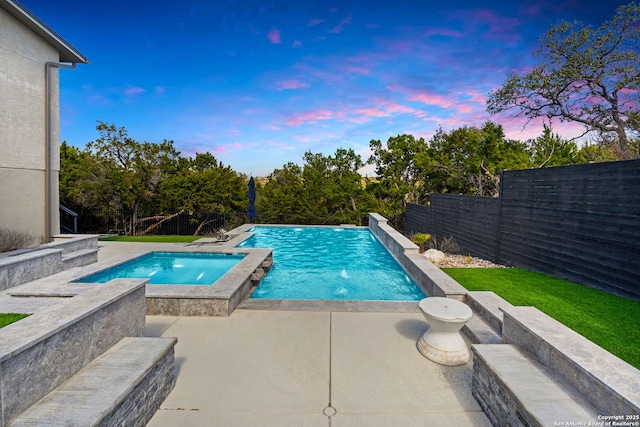 view of pool with a fenced in pool, a fenced backyard, and a patio