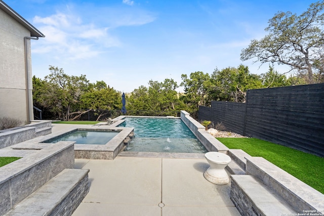 outdoor pool featuring a patio area, a fenced backyard, and an in ground hot tub