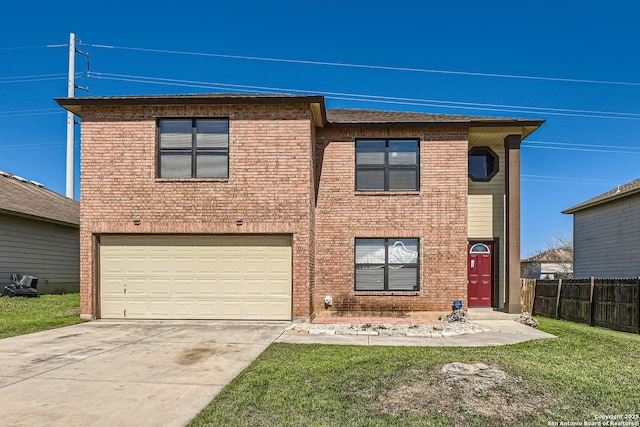 traditional home featuring a garage, concrete driveway, fence, a front lawn, and brick siding