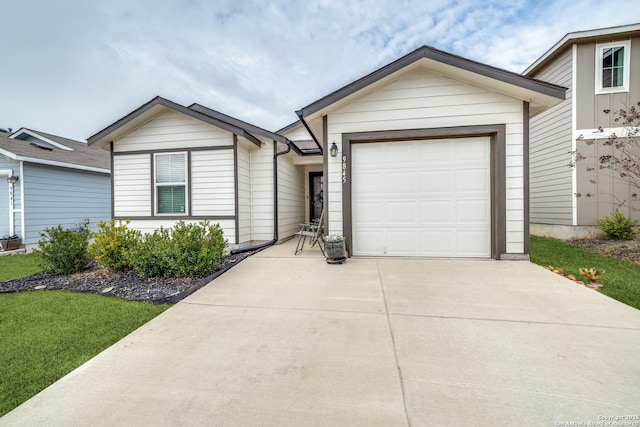 ranch-style home featuring driveway and a garage