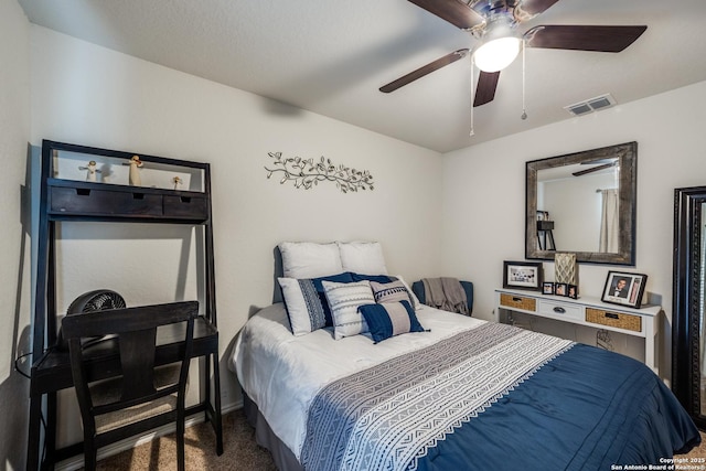 bedroom featuring a ceiling fan, visible vents, and carpet flooring