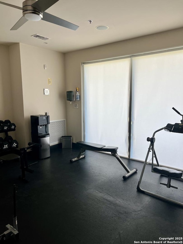 workout room featuring ceiling fan and visible vents