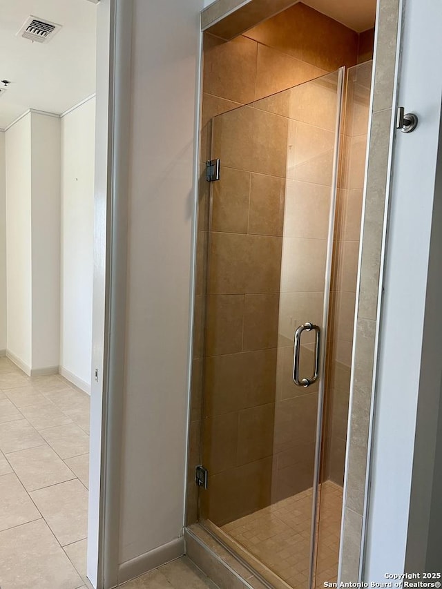 full bath featuring baseboards, a shower stall, visible vents, and tile patterned flooring