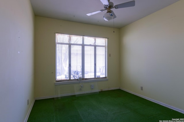 spare room with a ceiling fan, carpet flooring, and baseboards