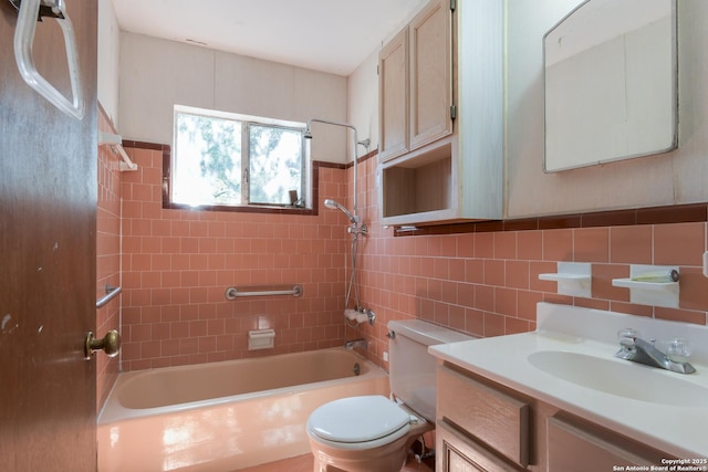 full bath featuring shower / bath combination, toilet, tile walls, and vanity