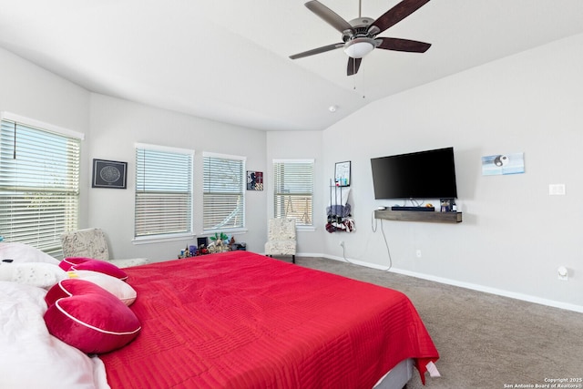 carpeted bedroom with lofted ceiling, multiple windows, a ceiling fan, and baseboards