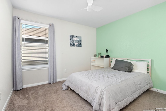 carpeted bedroom with a ceiling fan and baseboards