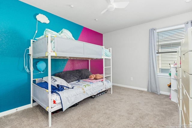 bedroom with carpet floors, ceiling fan, and baseboards