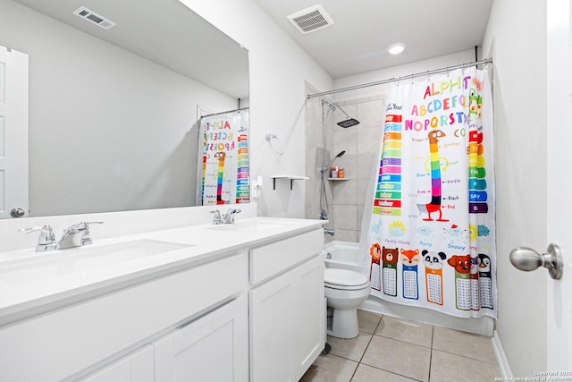 bathroom featuring a sink, visible vents, and tile patterned floors