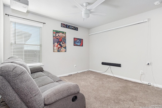 living room with ceiling fan, carpet flooring, and baseboards