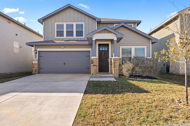 view of front facade with an attached garage, board and batten siding, stone siding, driveway, and a front lawn