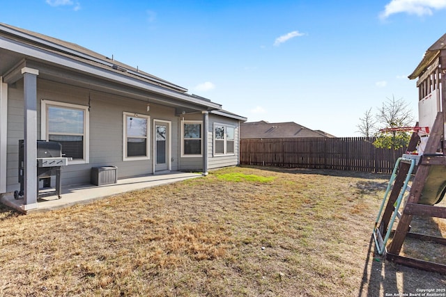 view of yard with fence and a patio