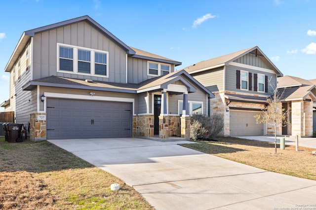 view of front of house with a garage, driveway, and board and batten siding