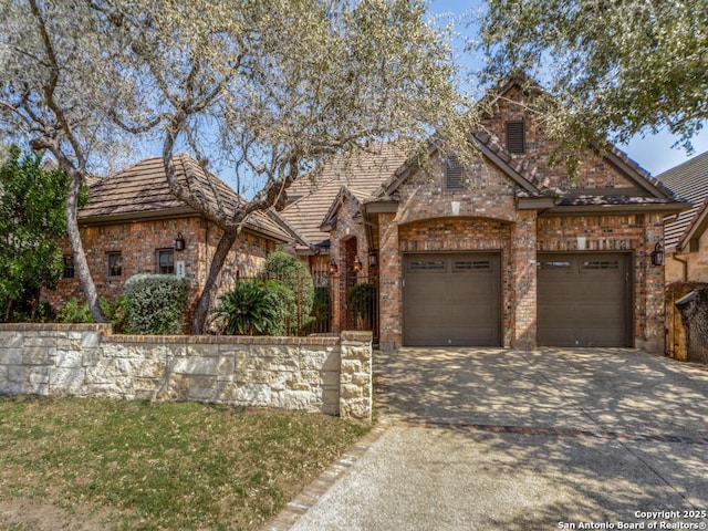 view of front of property with driveway and an attached garage