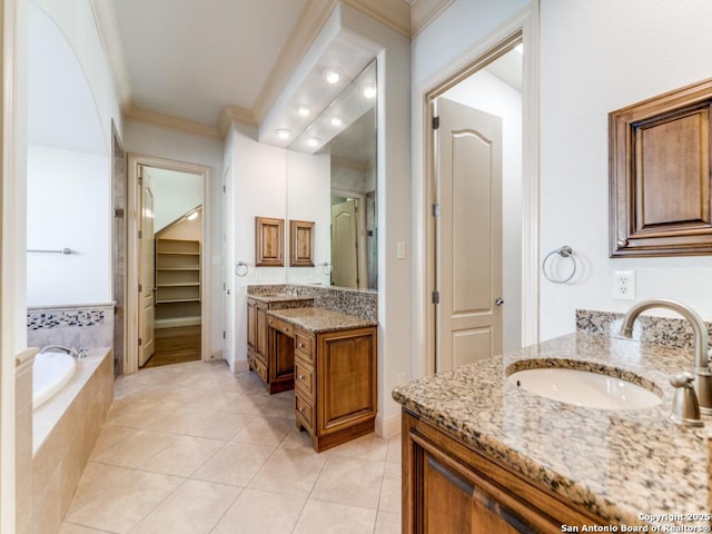 full bath with crown molding, two vanities, a sink, tile patterned flooring, and a bath