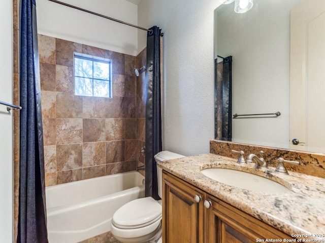 bathroom featuring toilet, shower / bathtub combination with curtain, and vanity