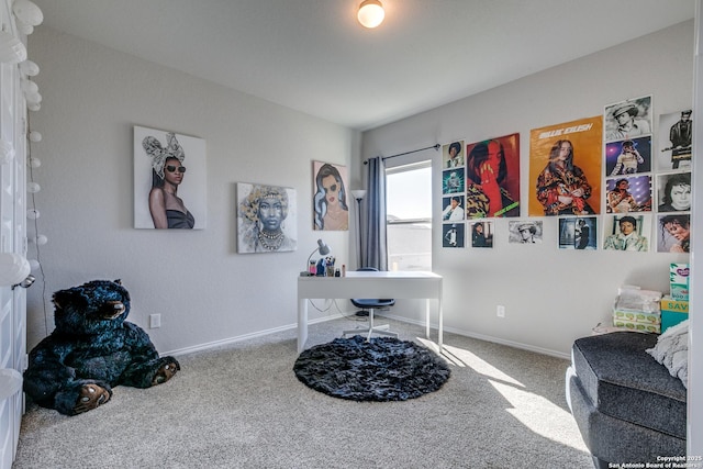 carpeted home office featuring baseboards