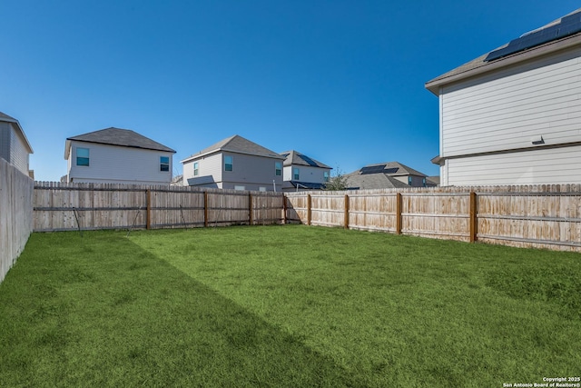 view of yard with a fenced backyard