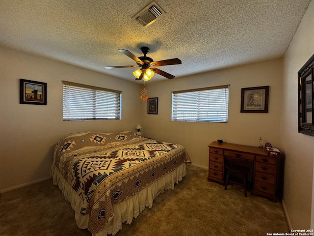 bedroom with multiple windows, visible vents, and carpet flooring