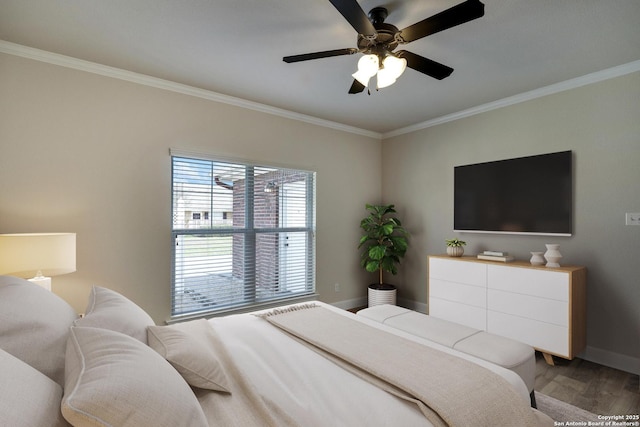 bedroom with ornamental molding, light wood-style flooring, and baseboards