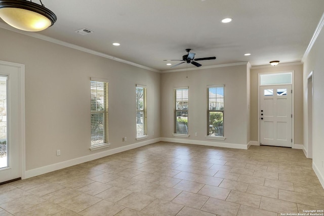 interior space featuring baseboards, visible vents, and crown molding