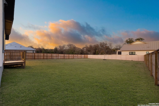 view of yard with a fenced backyard