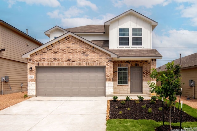 view of front of home with concrete driveway, stone siding, an attached garage, board and batten siding, and brick siding