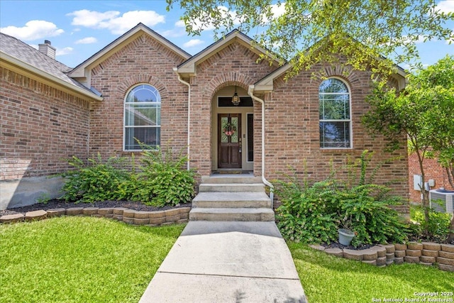 25723 Preserve Crst, San Antonio, TX 78261 - property entrance featuring brick siding and a lawn