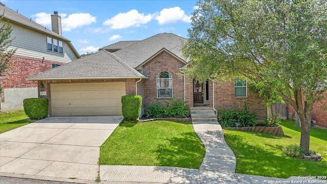25723 Preserve Crst, San Antonio, TX 78261 - traditional-style home with brick siding, an attached garage, a front lawn, and driveway