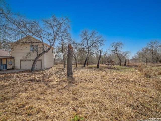 view of yard featuring a garage