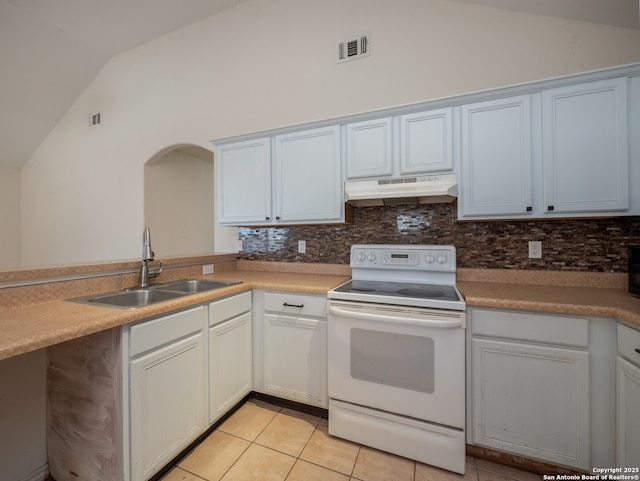 kitchen with under cabinet range hood, a sink, visible vents, vaulted ceiling, and electric stove