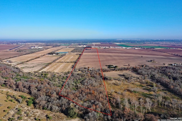 birds eye view of property featuring a rural view