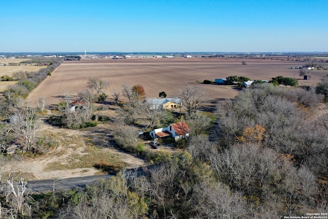 birds eye view of property with a rural view