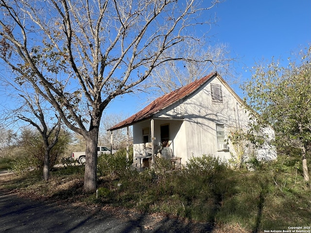 view of property exterior with stucco siding