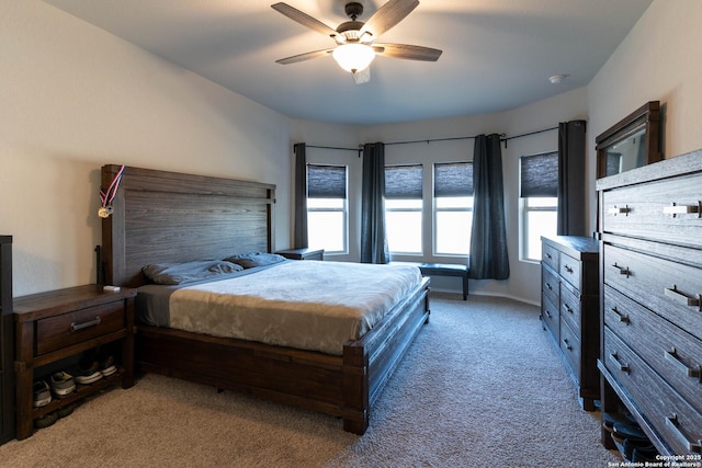 bedroom with carpet, baseboards, and ceiling fan