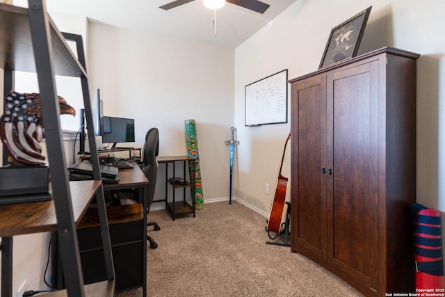 office area with light carpet, ceiling fan, and baseboards