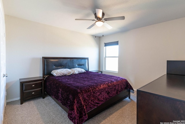 bedroom with ceiling fan and carpet floors