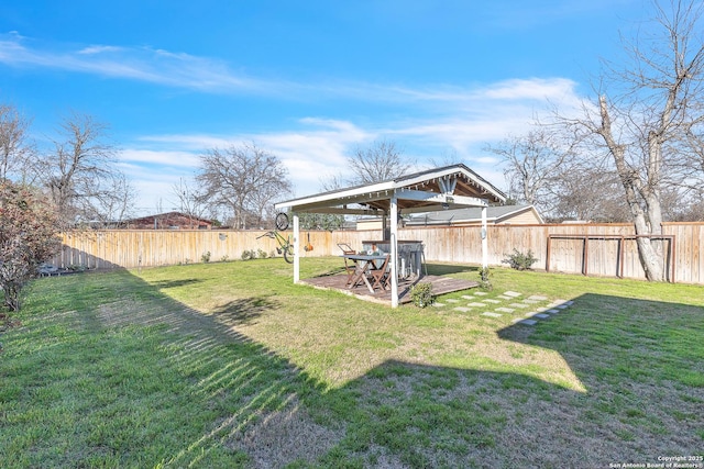 view of yard featuring a fenced backyard and a gazebo