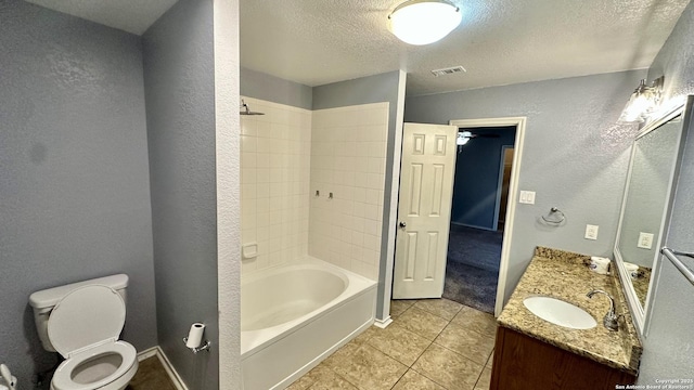 915 Ridingate Farm, San Antonio, TX 78228 - bathroom with a textured ceiling, a textured wall, toilet, visible vents, and tub / shower combination