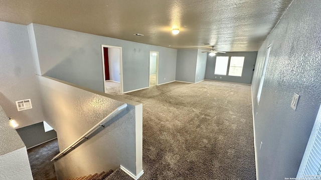915 Ridingate Farm, San Antonio, TX 78228 - carpeted empty room with ceiling fan, visible vents, and a textured ceiling