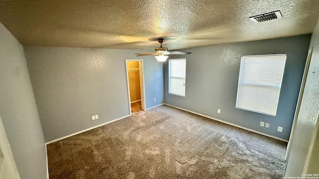 915 Ridingate Farm, San Antonio, TX 78228 - empty room featuring carpet floors, visible vents, ceiling fan, a textured ceiling, and baseboards