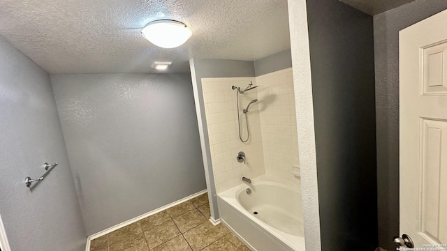 915 Ridingate Farm, San Antonio, TX 78228 - bathroom with a textured ceiling, a textured wall, baseboards, shower / bathing tub combination, and tile patterned floors