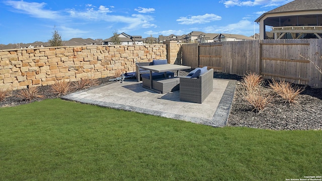 view of yard featuring a patio, a fenced backyard, and a residential view