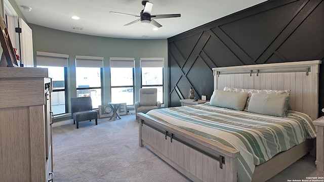 bedroom featuring ceiling fan, recessed lighting, visible vents, and light colored carpet