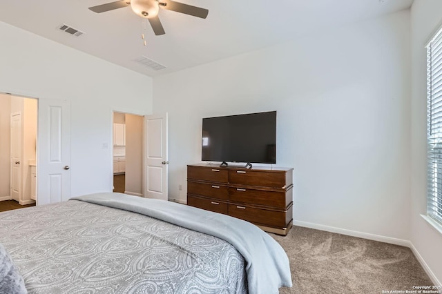 carpeted bedroom with baseboards, visible vents, and a ceiling fan