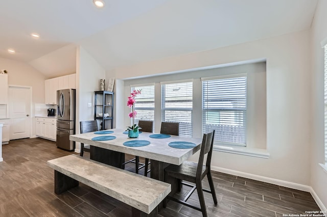 dining room with dark wood-style floors, recessed lighting, vaulted ceiling, and baseboards