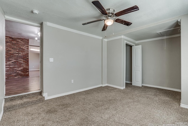 unfurnished bedroom featuring attic access, carpet, and a textured ceiling