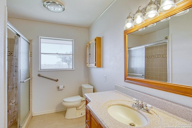 full bathroom featuring toilet, a shower stall, and vanity